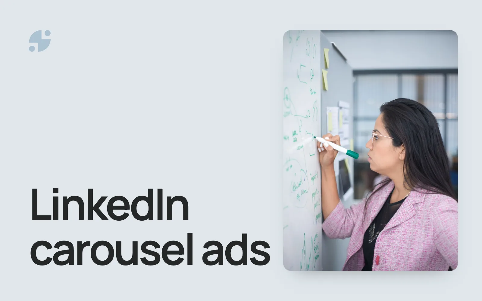 LinkedIn carousel ads. A manager planning a campaign on a whiteboard.